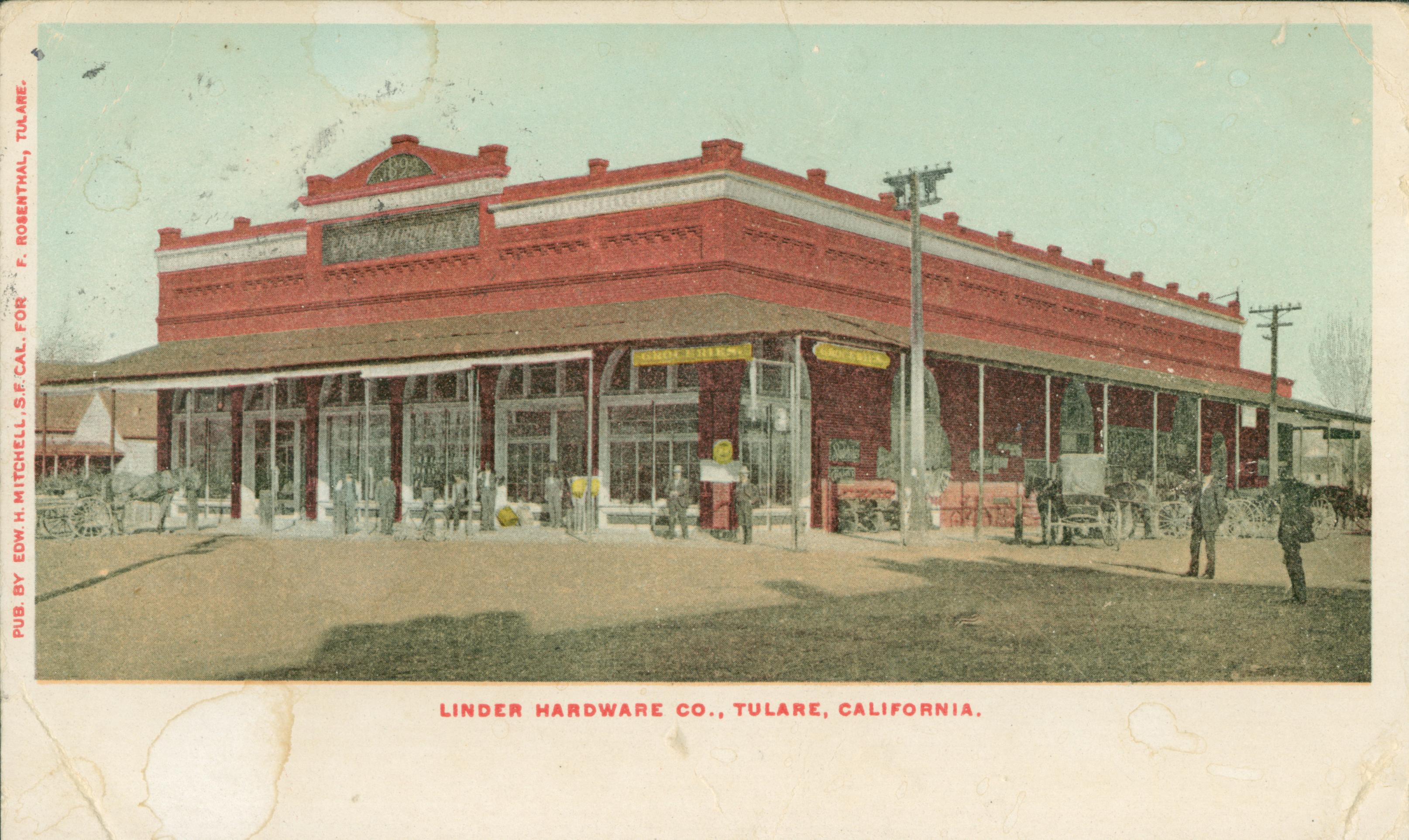 Shows a corner view of the Linder Hardware company in Tulare